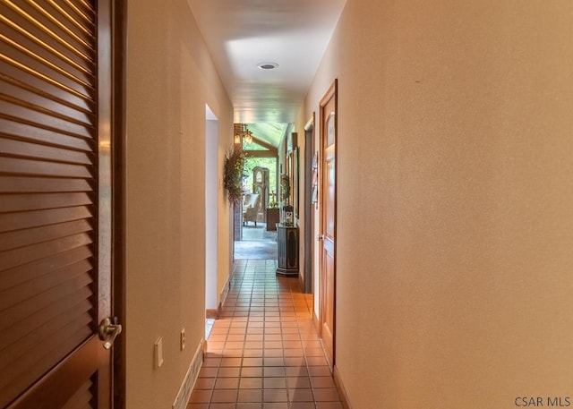 corridor with light tile patterned flooring