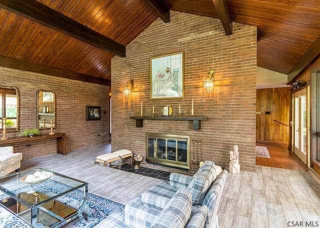 living room with brick wall, beam ceiling, high vaulted ceiling, and wood-type flooring