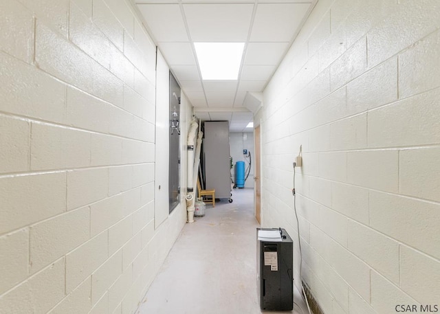 hallway with concrete flooring