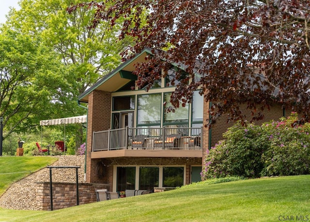 rear view of house with a lawn