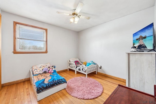 bedroom with ceiling fan and wood-type flooring