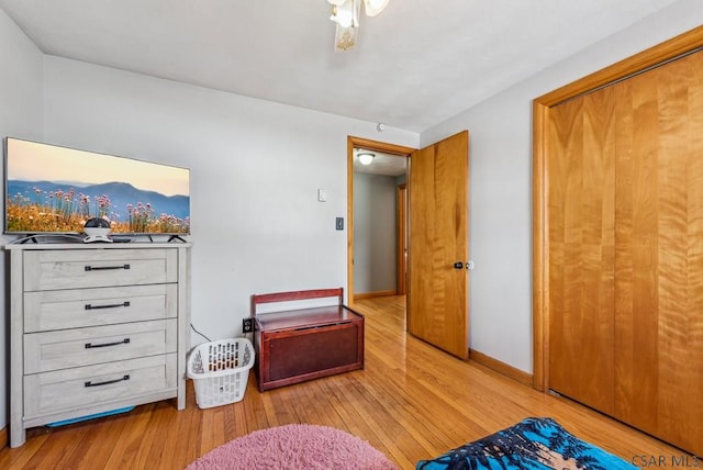 bedroom with ceiling fan and light wood-type flooring