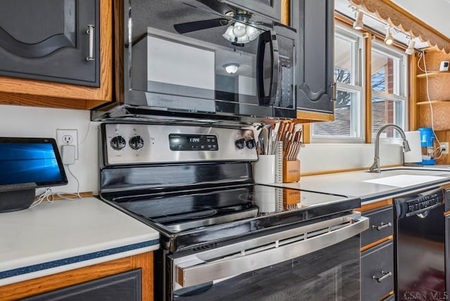 kitchen with sink, ceiling fan, and black appliances