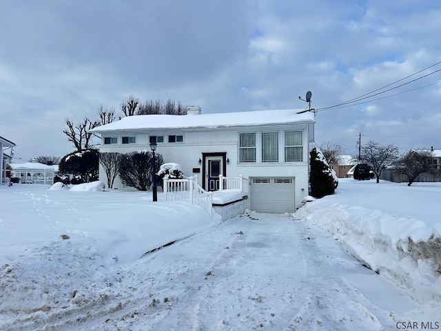 bi-level home featuring a garage