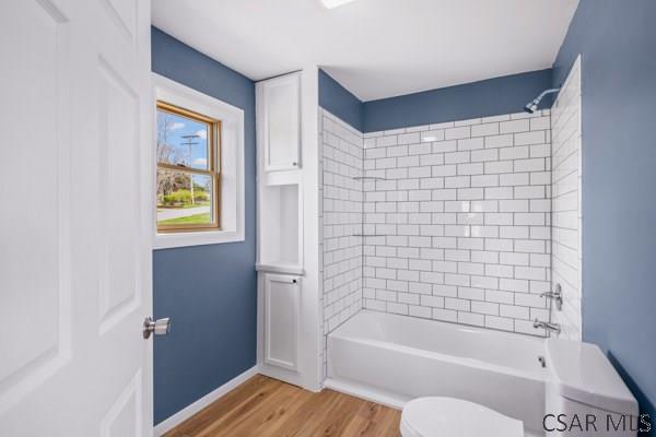 3445 Graham Ave, Windber, PA 15963 - bathroom with wood finished floors and shower / washtub combination