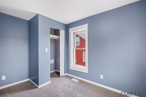 3445 Graham Ave, Windber, PA 15963 - unfurnished bedroom with carpet floors and a closet