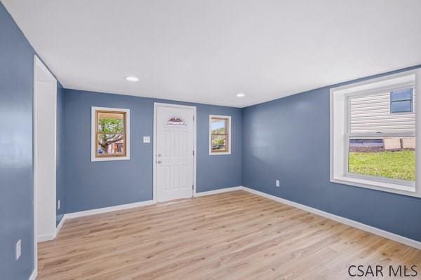 3445 Graham Ave, Windber, PA 15963 - empty room with light wood-style floors, plenty of natural light, and recessed lighting
