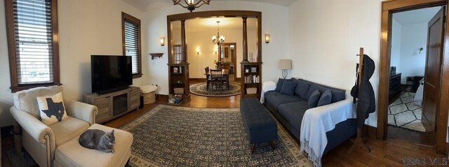 living room featuring hardwood / wood-style floors and a chandelier