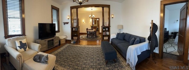 living room featuring hardwood / wood-style floors and a chandelier