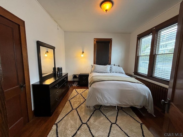 bedroom with hardwood / wood-style flooring