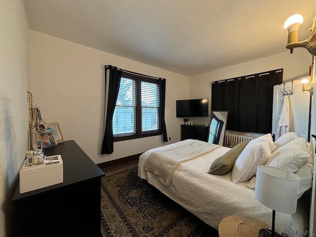 bedroom featuring radiator heating unit