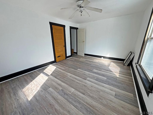 unfurnished bedroom with light wood-type flooring and ceiling fan