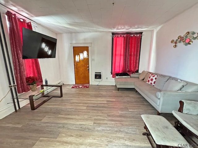 living room featuring light hardwood / wood-style flooring and heating unit