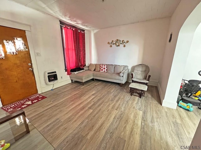 living room featuring light hardwood / wood-style flooring and heating unit