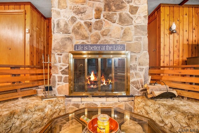 details featuring crown molding, a fireplace, and wooden walls