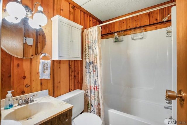 full bathroom with toilet, wooden walls, shower / tub combo, and a textured ceiling