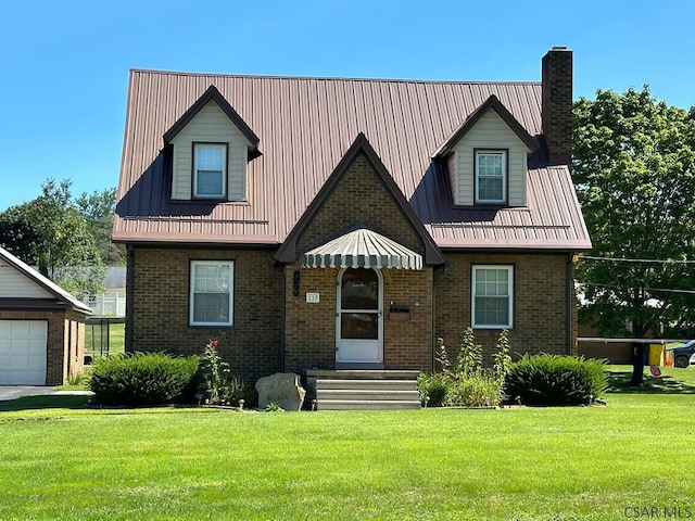 view of front of home featuring an outbuilding, a garage, and a front lawn