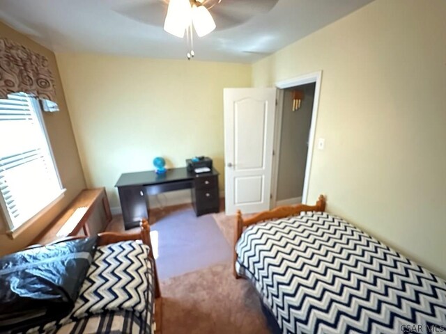 carpeted bedroom with ceiling fan