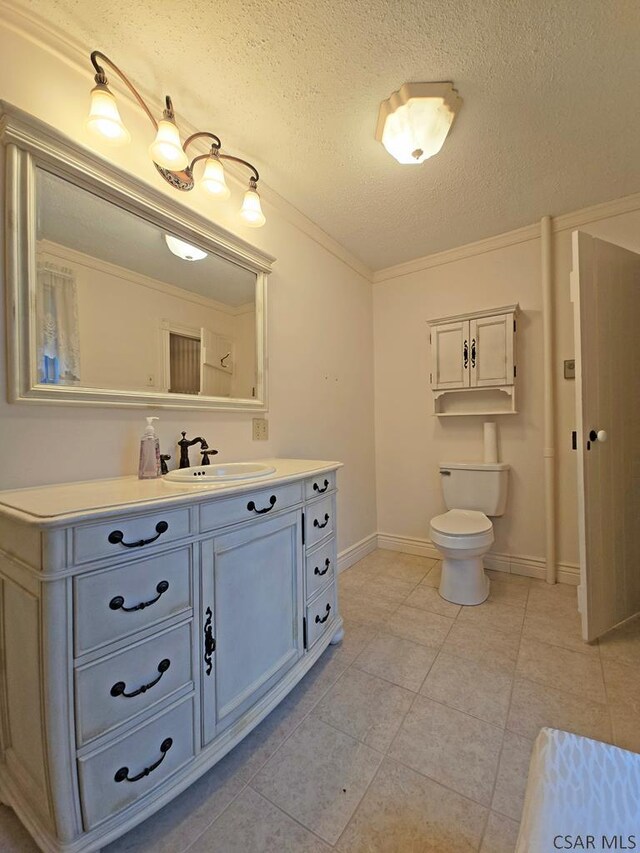 bathroom featuring vanity, crown molding, toilet, and a textured ceiling