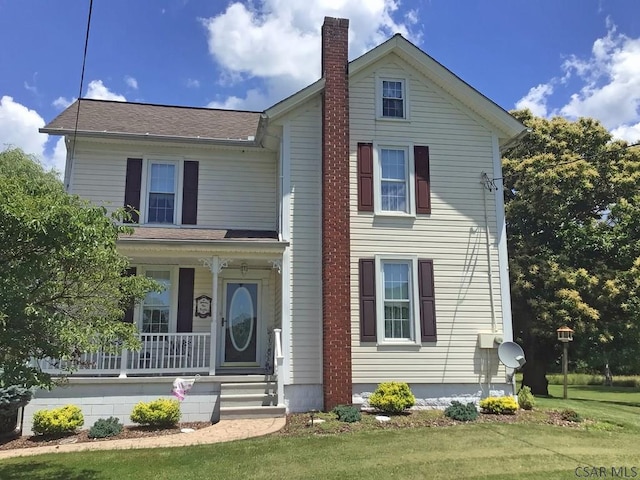 view of front facade featuring a porch and a front yard