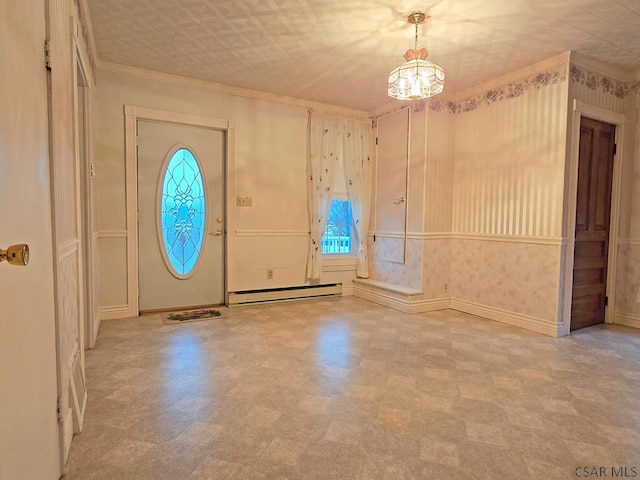 foyer featuring a baseboard radiator, a wealth of natural light, and crown molding