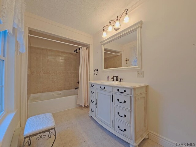 bathroom with shower / tub combo, vanity, and a textured ceiling