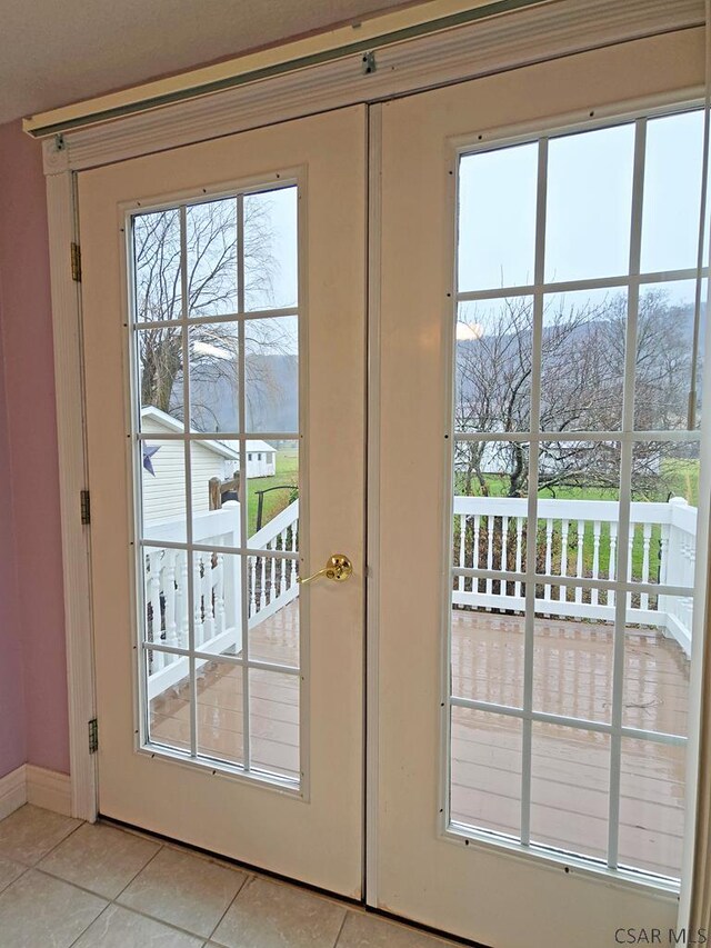 doorway featuring light tile patterned floors