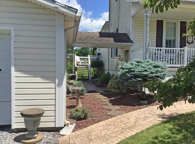 view of side of property with a porch