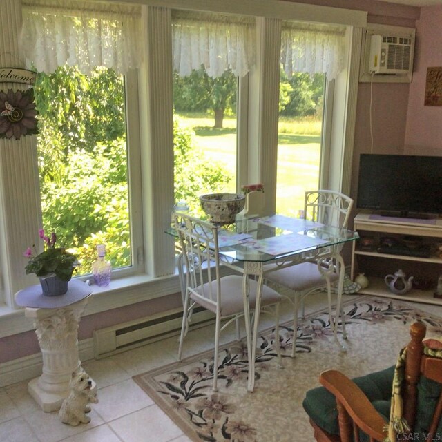 dining area with a wall unit AC and light tile patterned floors