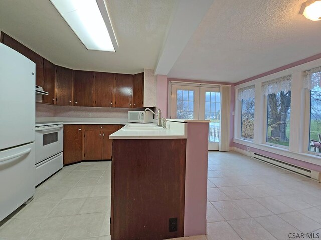 kitchen featuring a baseboard radiator, sink, white appliances, dark brown cabinets, and a textured ceiling