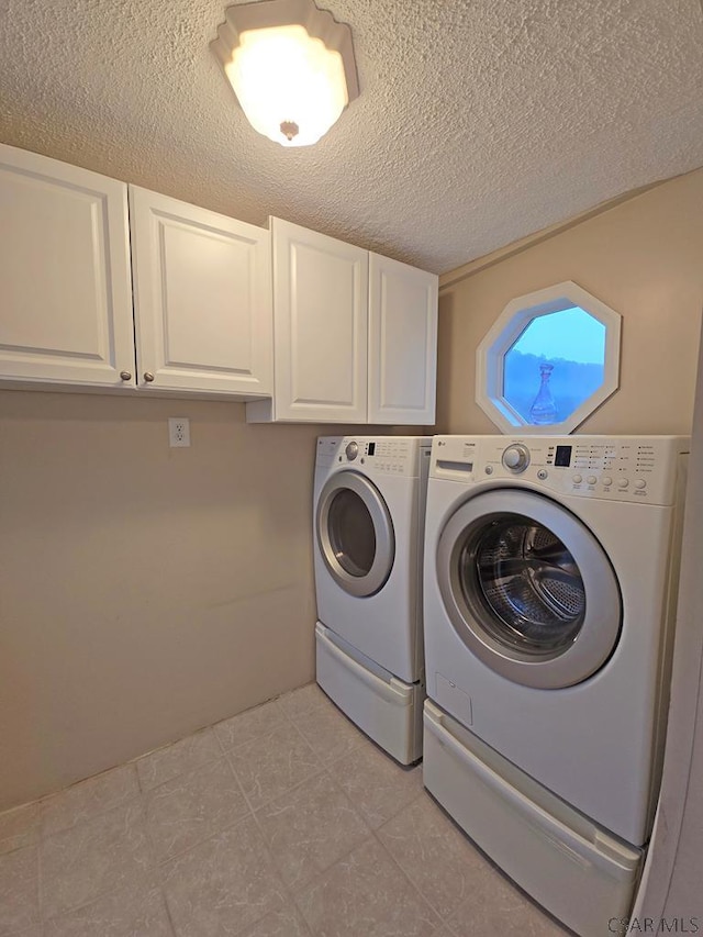 laundry area featuring cabinets and independent washer and dryer