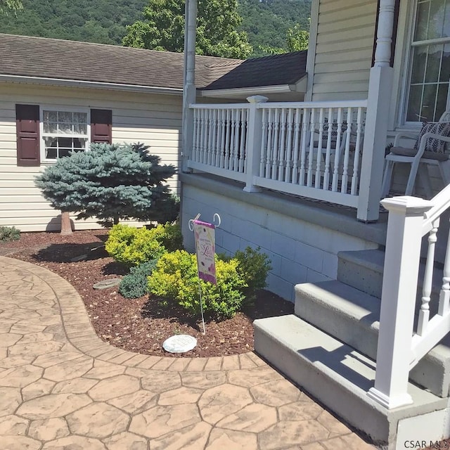 view of side of home featuring a balcony