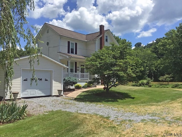 view of front facade featuring a front yard and covered porch