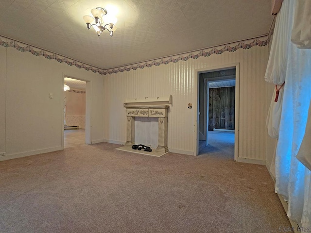 unfurnished living room featuring a baseboard heating unit