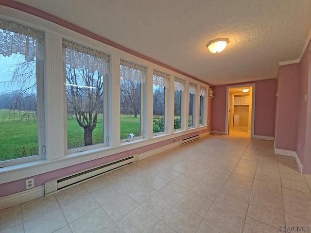 unfurnished sunroom with a baseboard radiator