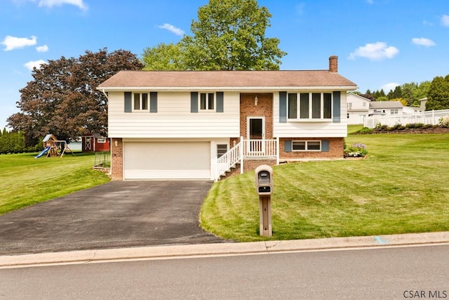 129 Berkey Dr, Johnstown, PA 15904 - bi-level home with a chimney, an attached garage, brick siding, and asphalt driveway