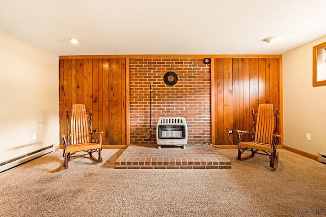 129 Berkey Dr, Johnstown, PA 15904 - sitting room featuring heating unit, wood walls, carpet floors, baseboard heating, and a wood stove