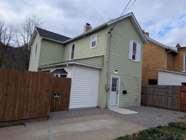 rear view of property featuring a patio