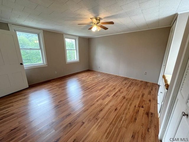 328 Thatcher Rd, New Florence, PA 15944 - empty room featuring light wood-style flooring, a ceiling fan, and ornamental molding