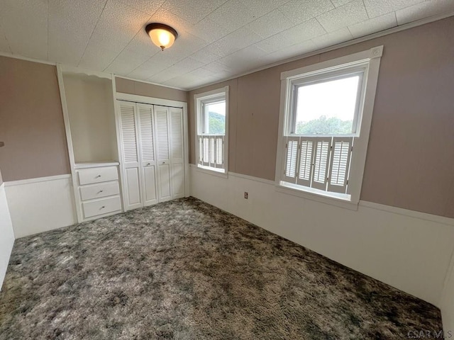 328 Thatcher Rd, New Florence, PA 15944 - unfurnished bedroom with a closet, carpet flooring, and a wainscoted wall