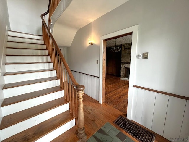 328 Thatcher Rd, New Florence, PA 15944 - staircase with wood finished floors and a stone fireplace