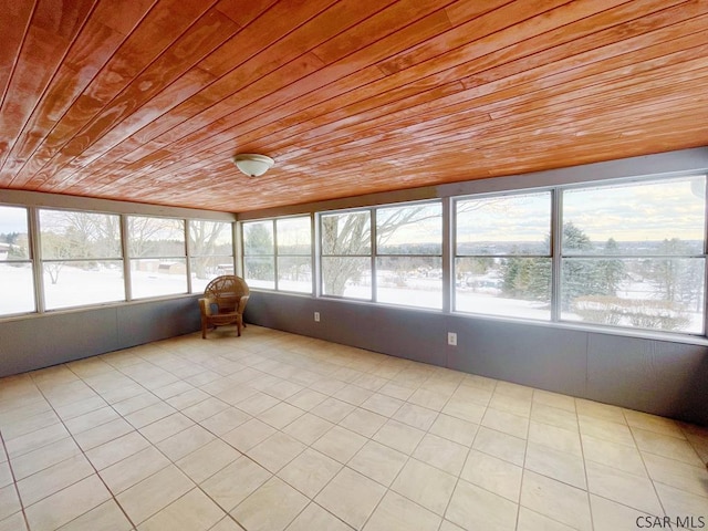 unfurnished sunroom with wooden ceiling