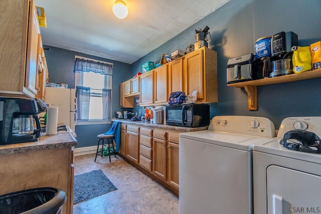 laundry room featuring independent washer and dryer