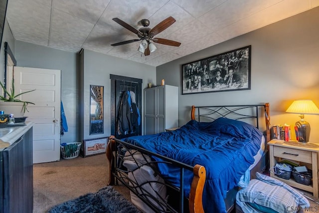 bedroom featuring ceiling fan and carpet flooring