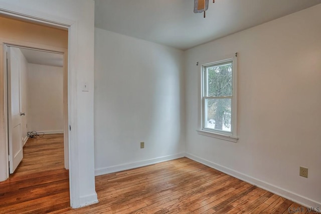 unfurnished room with ceiling fan and light hardwood / wood-style floors