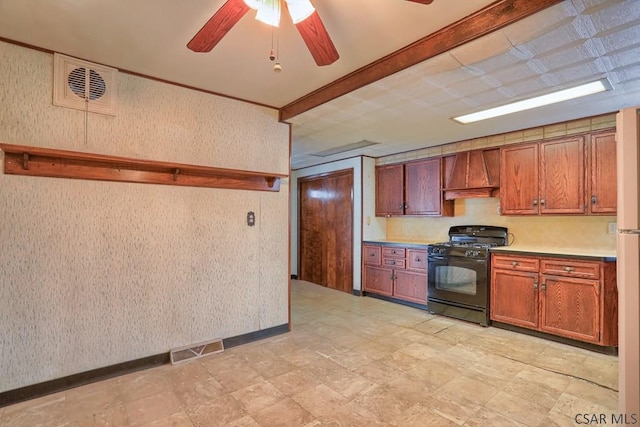 kitchen featuring ceiling fan, custom range hood, and black gas range oven