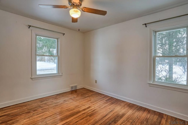 unfurnished room with ceiling fan and light hardwood / wood-style flooring