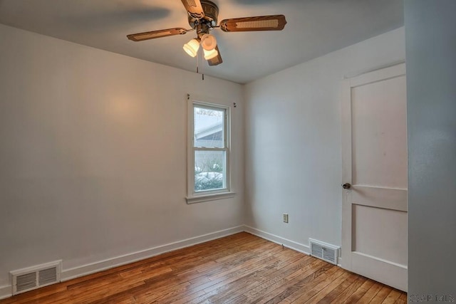 empty room with light hardwood / wood-style floors and ceiling fan