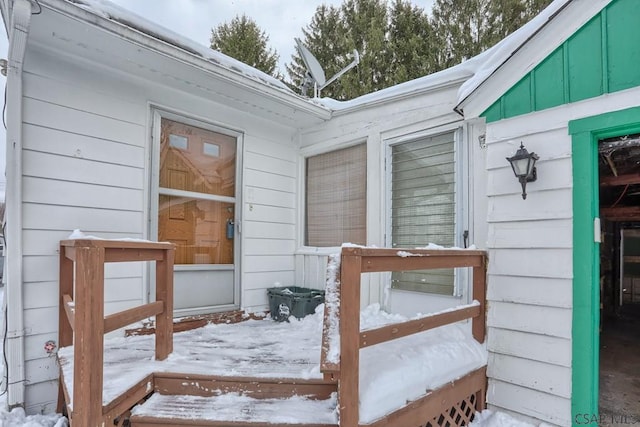 view of snow covered property entrance