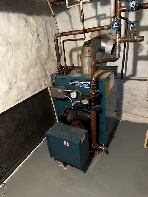 utility room featuring a heating unit